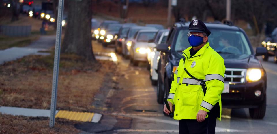 Randolph Special Officer Walter Lewis controls traffic going into the Randolph COVID-19 testing facility at the Zapustas Ice Arena in Randolph.