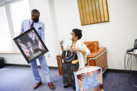 Rev. Dante Quick, receives a present with the picture of former President Barack Obama after preaching during a church service at the First Baptist Church of Lincoln Gardens on Sunday, May 22, 2022, in Somerset, N.J. (AP Photo/Eduardo Munoz Alvarez)
