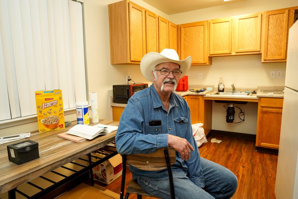 Jim Box of Redding sits in his home at Lauren Glen Apartments on Dec. 8, 2023. It has been almost a year since the 64-year-old was able to move out of the Cascade Motel and into permanent housing.