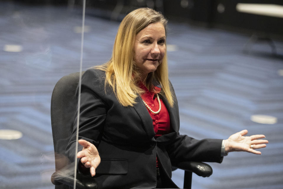 In this Feb. 2, 2021, photo, Virginia Sen. Amanda Chase and Republican gubernatorial candidate, speaks from her desk at the Science Museum of Virginia in Richmond, Va. The national Republican Party is at war with itself, struggling to reconcile a bitter divide between former President Donald Trump’s fierce loyalists and those who want Trumpism purged from their party. Chase is a polarizing state senator who seems to have won the hearts and minds of the Trump faithful with her fiercely anti-establishment, pro-gun positions and her embrace of the false notion that Trump is the legitimate winner of the November election. (AP Photo/Ryan M. Kelly)