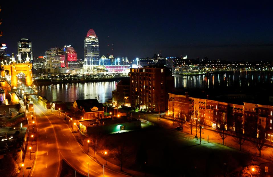 Buildings in downtown Cincinnati were lit red early Thursday for the Cincinnati Reds and Opening Day.