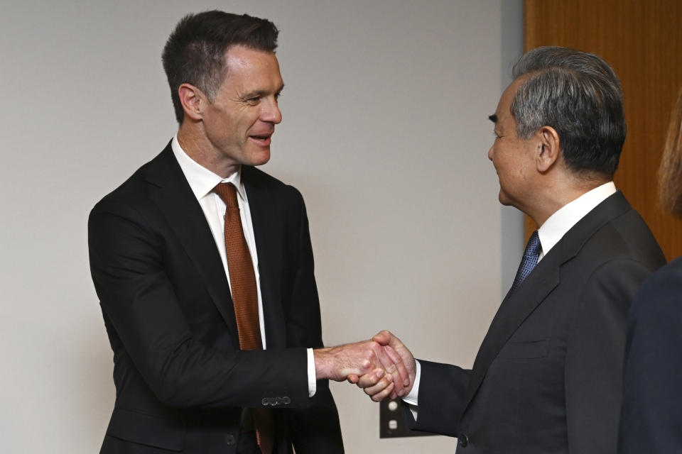 Chinese Foreign Minister Wang Yi, right, meets with New South Wales state Premier Chris Minns during a visit to New South Wales Parliament House in Sydney, Thursday, March 21, 2024. Australia received its most senior Chinese leadership visit in nearly seven years with Wang's arrival Wednesday. (Dean Lewins/Pool Photo via AP)