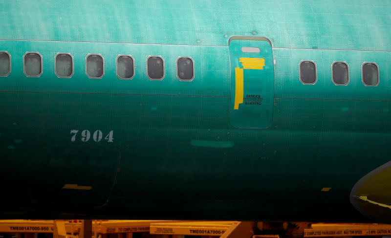 FILE PHOTO: The side of a Boeing 737 Max fuselage is seen parked outside the company's production facility in Renton