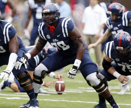 FILE - In this Sept. 13, 2014, file photo, Mississippi offensive linesman Laremy Tunsil (78) steps into his blocking stance during pre-game warmups prior to an NCAA college football game against Louisiana-Lafayette at Vaught-Hemingway Stadium in Oxford, Miss. The Rebels have rocketed from an SEC afterthought to the No. 3 team in the country by bringing in better talent, starting with a talented sophomore class that includes Robert Nkemdiche, Laquon Treadwell and Tunsil. (AP Photo/Rogelio V. Solis)