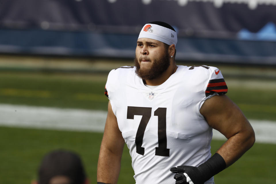 FILE - In this Sunday, Dec. 6, 2020 file photo, Cleveland Browns offensive tackle Jedrick Wills (71) takes the field for an NFL football game against the Tennessee Titans in Nashville, Tenn. Already down their four top wide receivers due to COVID-19 protocols, the Cleveland Browns will also be without starting rookie left tackle Wills when they play the New York Jets on Sunday, Dec. 27 with a possible playoff spot on the line. Wills had been placed on the COVID list on Thursday, Dec. 24 after being in close contact with someone outside the team who had tested positive. (AP Photo/Wade Payne, File)