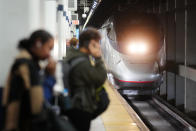 An Amtrak train arrives ahead of the Thanksgiving Day holiday at 30th Street Station in Philadelphia, Wednesday, Nov. 22, 2023. (AP Photo/Matt Rourke)