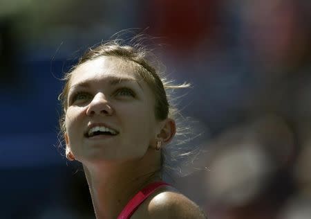 Simona Halep of Romania reacts after defeating Danielle Rose Collins of the U.S. during their match at the 2014 U.S. Open tennis tournament in New York, August 25, 2014. REUTERS/Mike Segar