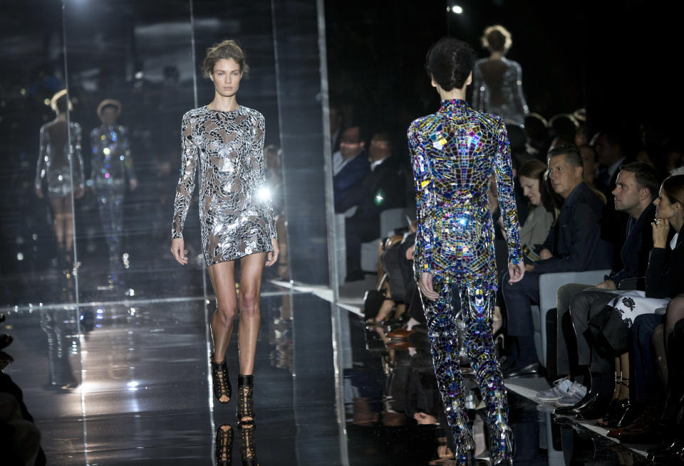 Models wear designs created by Tom Ford during London Fashion Week Spring/Summer 2014, at Lindley Hall, central London, Monday, Sept. 16, 2013. (Photo by Joel Ryan/Invision/AP)