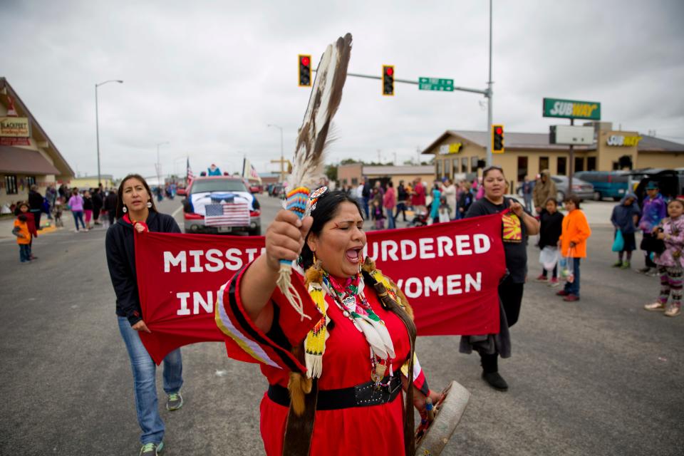 Roxanne White yells "Say Her Name" while marching with family members of Ashley HeavyRunner Loring in an attempt to raise awareness of her disappearance as they march in the North American Indian Days parade on the Blackfeet Indian Reservation in Browning, Mont., Saturday, July 14, 2018.