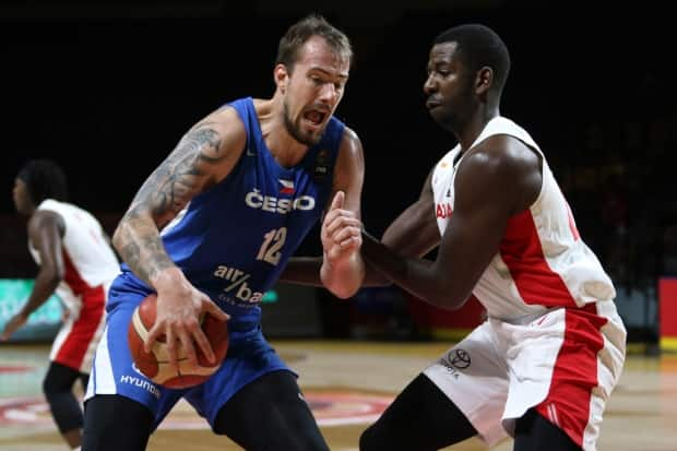 Andrew Nicholson, right, defends against Czech Republic's Ondrej Balvin during Saturday’s 103-101 semifinal defeat, at the hands of the Czech Republic, that ended Canada’s Olympic dream.  (Chad Hipolito/The Canadian Press - image credit)