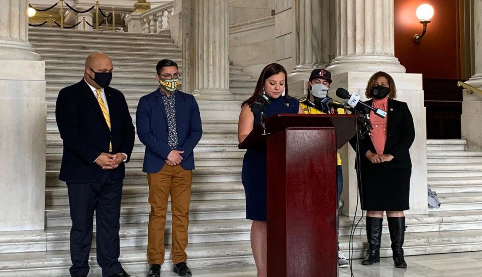 Rep. Karen Alzate speaks at a press conference held by the Rhode Island Legislative Black and Latino Caucus.