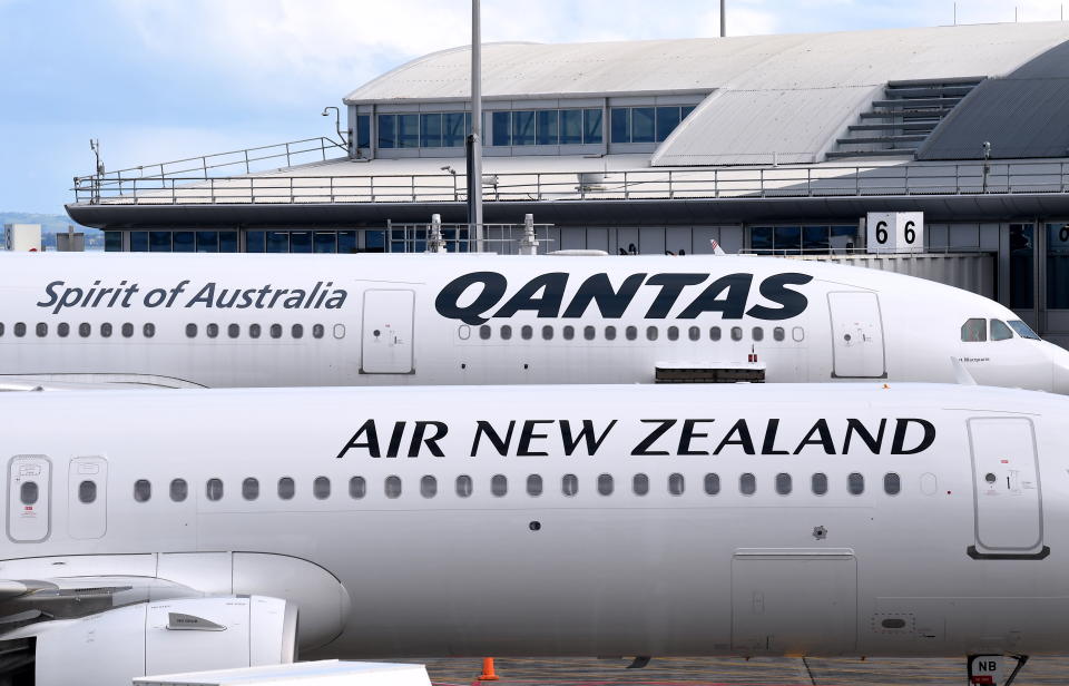 AUCKLAND, NEW ZEALAND - APRIL 19: QANTAS and Air New Zealand planes that recently flew from Australia are parked at the Auckland Airport terminal on April 19, 2021 in Auckland, New Zealand. The trans-Tasman travel bubble between New Zealand and Australia begins on Monday, with people able to travel between the two countries without needing to quarantine. (Photo by James D. Morgan/Getty Images)