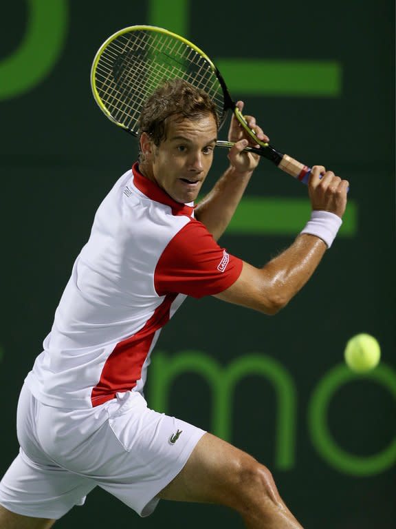 Richard Gasquet of France plays a backhand against Tomas Berdych of Czech Republic during their quarter-final match at the Sony Open at Crandon Park Tennis Center in Key Biscayne, Florida, on March 28, 2013. Gasquet won 6-3, 6-3