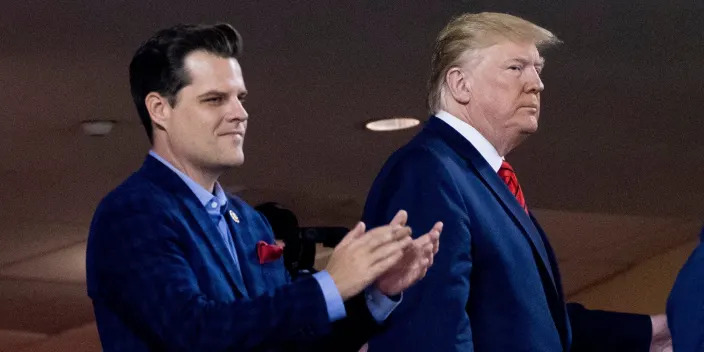In this Oct. 27, 2019, file photo President Donald Trump, right, accompanied by Rep. Matt Gaetz, R-Fla., left, arrive for Game 5 of the World Series baseball game between the Houston Astros and the Washington Nationals at Nationals Park in Washington.