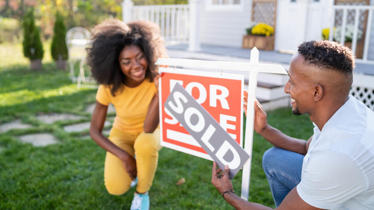 Young couple buying a new house.