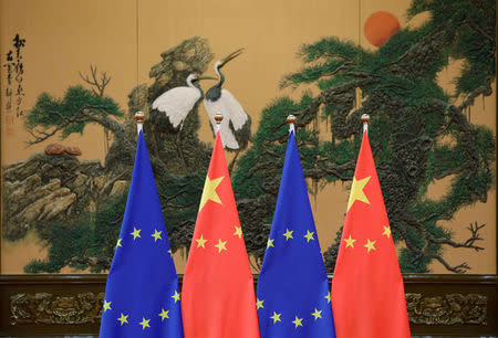 FILE PHOTO: Flags of European Union and China are pictured during the China-EU summit at the Great Hall of the People in Beijing, China, July 12, 2016. REUTERS/Jason Lee/File Photo