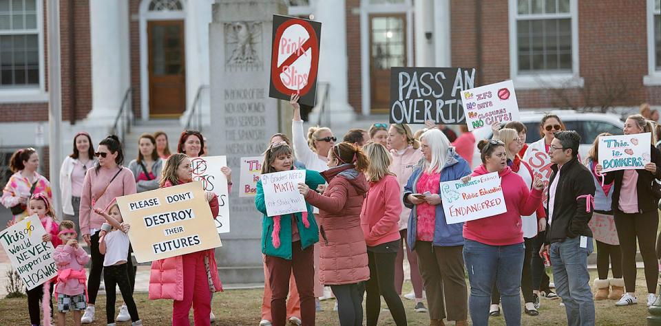 Braintree educators and parents protest proposed budget cuts and lay offs outside Braintree Town Hall before a School Committee meeting on Monday April 8, 2024