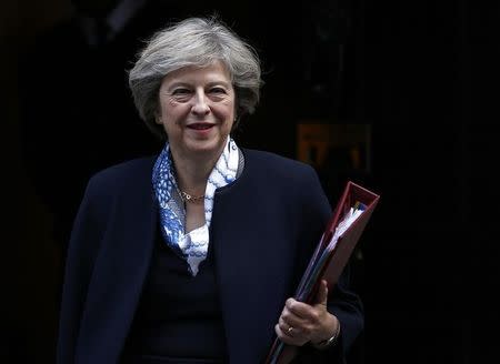 Britain's Prime Minister Theresa May leaves Number 10 Downing Street to attend Prime Minister's Questions at parliament in London, Britain October 12, 2016. REUTERS/Peter Nicholls