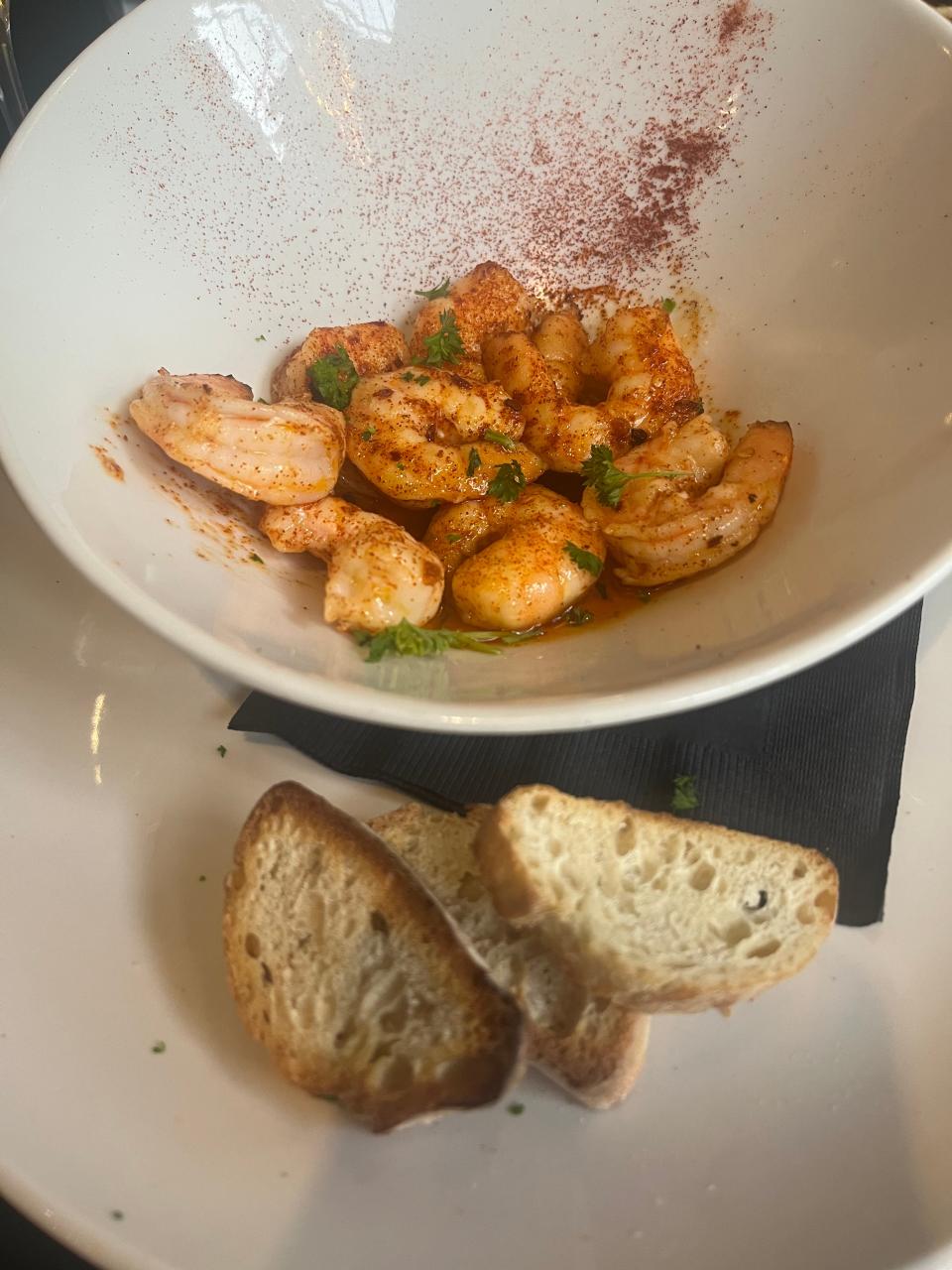 Spanish-style creamy garlic gambas at Van Edom's Wine Bar include eight large shrimp with seasoning.