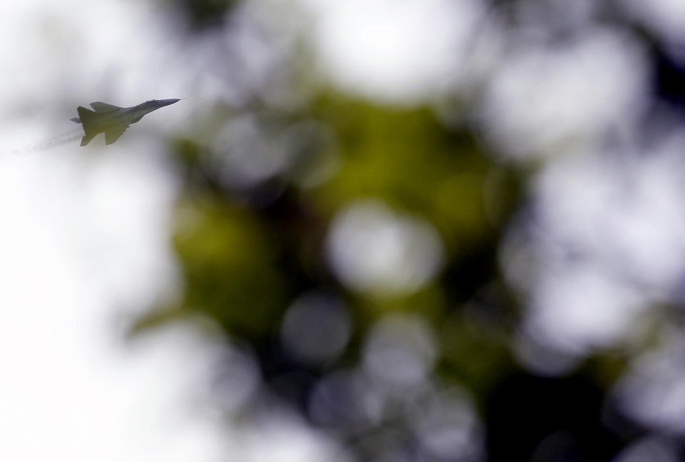 FILE - In this Tuesday, May 9, 2017 file photo, a Serbian army MiG-29 jet fighter performs during exercise at a ceremony marking 72 years since the end of WWII and the defeat of Nazi Germany, at Nikinci training ground, 60 kilometers west of Belgrade, Serbia. Serbia will continue to strengthen its armed forces and is ready to purchase more warplanes amid simmering tensions in the Balkans, the Serbian president said Sunday, July 26, 2020. (AP Photo/Darko Vojinovic, file)