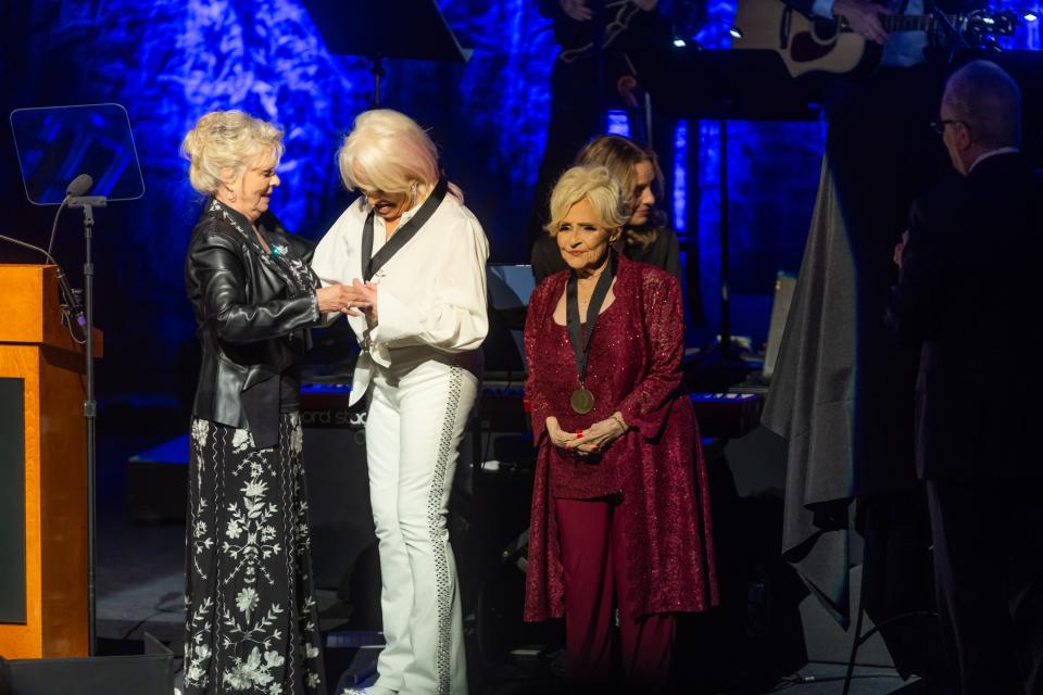 Connie Smith puts the hall of fame medallion around Tanya Tucker’s neck during the 2023 Country Music Hall of Fame induction ceremony Sunday, October 22, 2023.