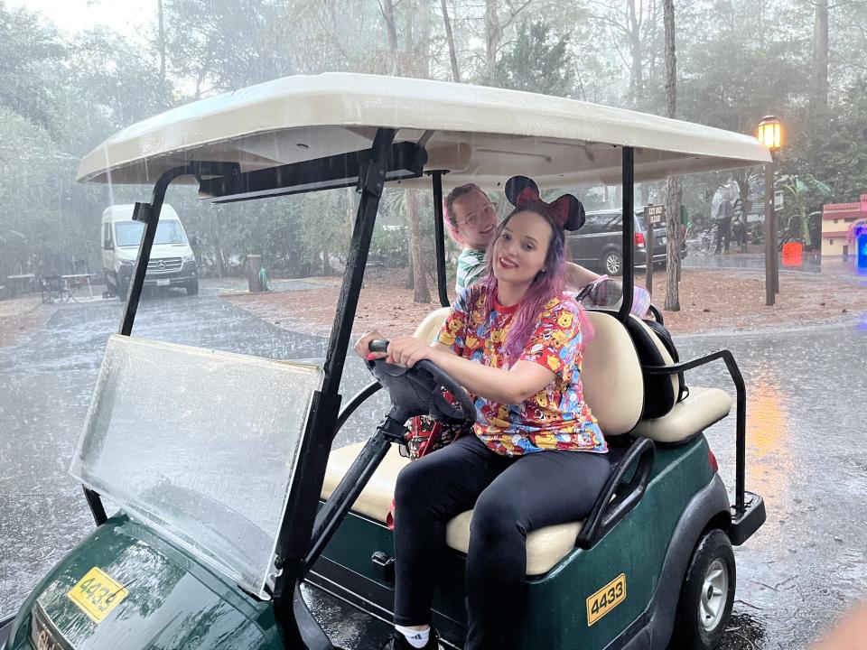 jenna clark driving the golf cart in the rain