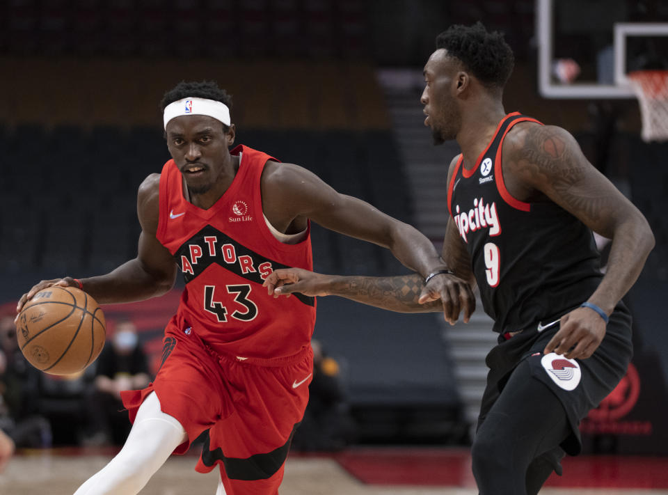 Toronto Raptors forward Pascal Siakam (43) drives past Portland Trail Blazers forward Nassir Little (9) during the first half of an NBA basketball game in Toronto, Sunday Jan. 23, 2022. (Frank Gunn/The Canadian Press via AP)