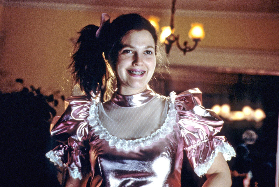 Drew Barrymore in a Victorian-style pink dress with puffed sleeves, as seen in the movie 'Never Been Kissed'