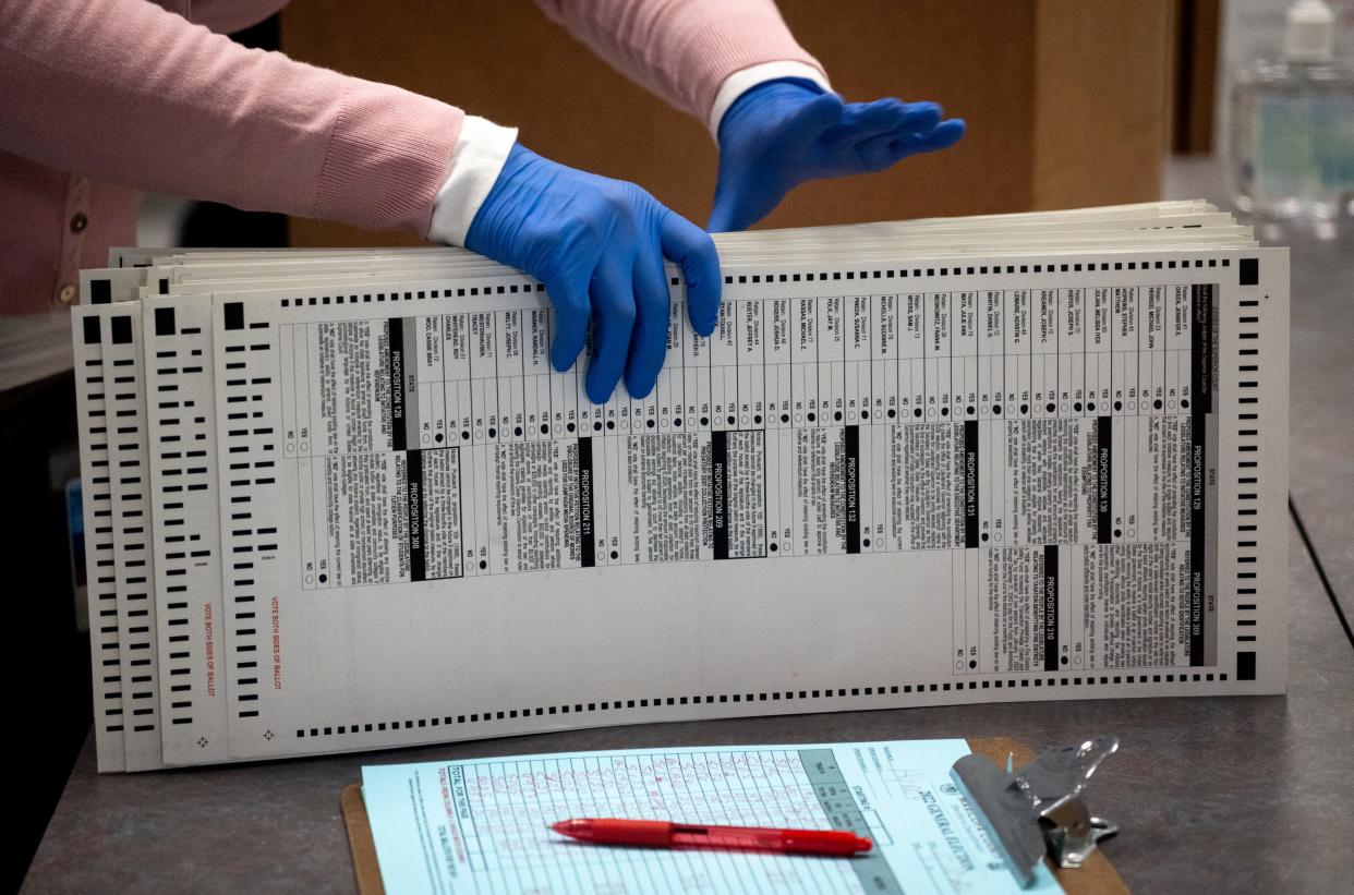 Ballots are processed on Nov. 10, 2022, at the Maricopa County Tabulation and Elections Center in Phoenix.