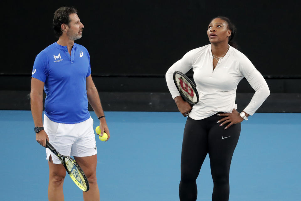 United States' Serena Williams and her coach Patrick Mouratoglou react during a practice session ahead of the Australian Open tennis championship in Melbourne, Australia, Friday, Jan. 17, 2020. (AP Photo/Lee Jin-man)