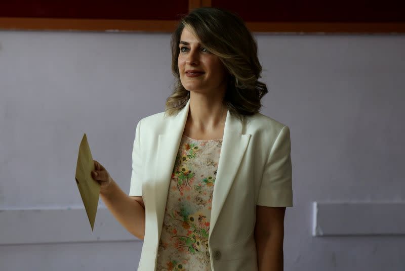 FILE PHOTO: Basak Demirtas, wife of Selahattin Demirtas, jailed former co-leader and presidential candidate of Turkey's main pro-Kurdish HDP, arrives at a polling station during the presidential and parliamentary elections in Diyarbakir