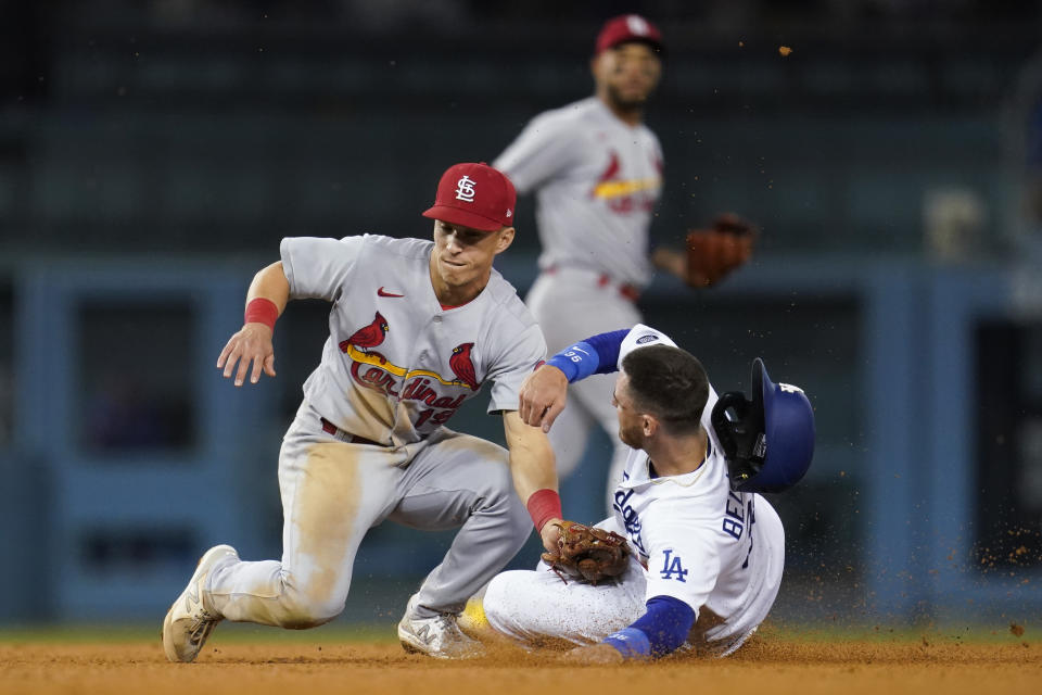 Los Angeles Dodgers' Cody Bellinger, right, steals second base ahead of a throw to St. Louis Cardinals second baseman Tommy Edman (19) during the seventh inning of a National League Wild Card playoff baseball game Wednesday, Oct. 6, 2021, in Los Angeles. (AP Photo/Marcio Jose Sanchez)