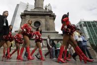 <p>Houston Texans cheerleaders perform in front of the Angel of Independence monument Sunday, Nov. 20, 2016, in Mexico City. The Texans face the Oakland Raiders in an NFL football game in Mexico City Nov. 21. (AP Photo/Gregory Bull) </p>