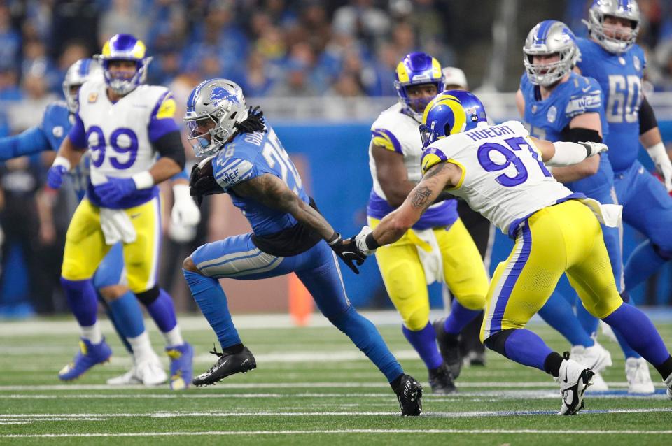 Detroit Lions running back Jahmyr Gibbs runs the ball in the first half against the L.A. Rams at Ford Field in Detroit on Sunday, Jan. 14, 2024.