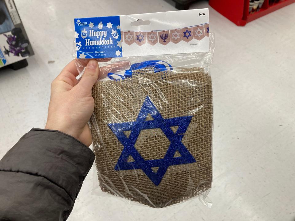 Hanukkah decor with burlap panels decorated with Jewish stars.