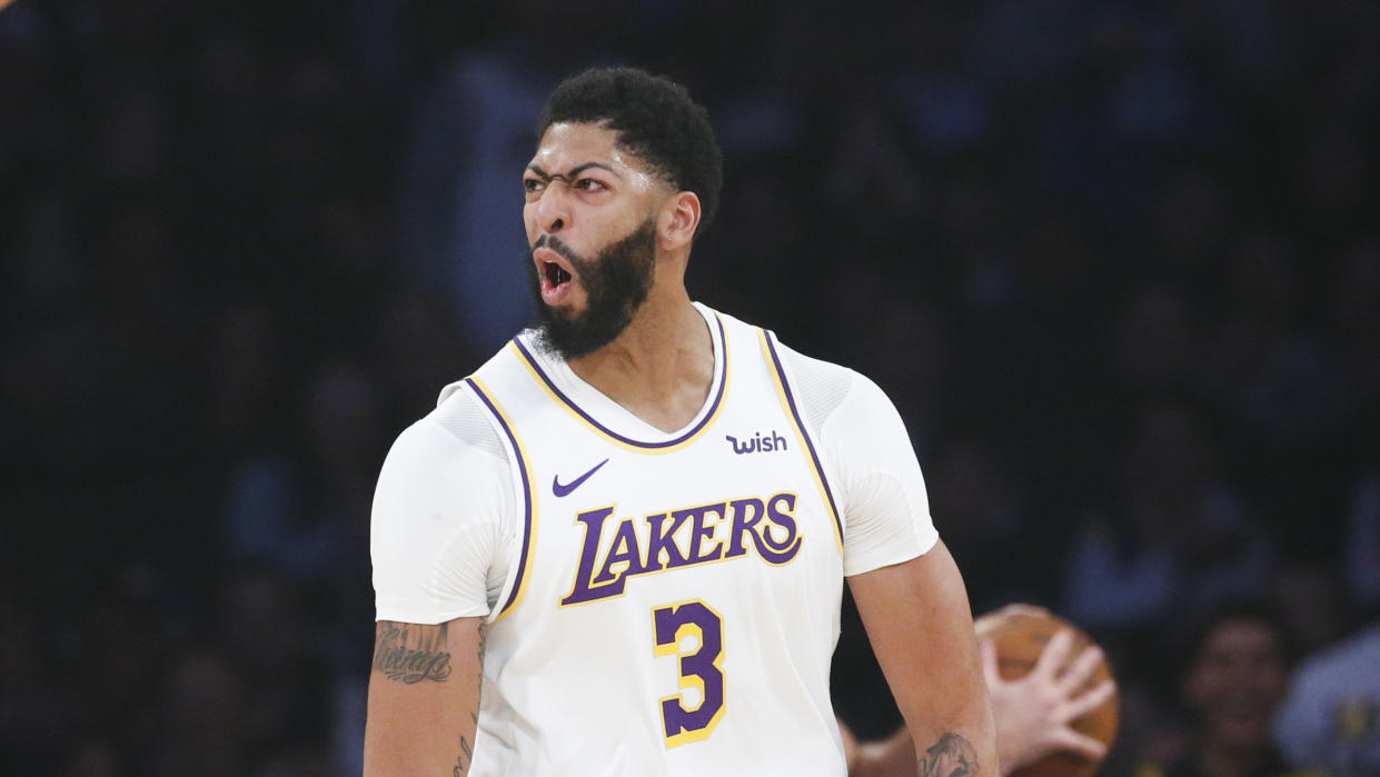 Los Angeles Lakers' Anthony Davis (3) reacts during the first half of an NBA basketball game against the Phoenix Suns , Wednesday, Jan. 1, 2020, in Los Angeles. (AP Photo/Ringo H.W. Chiu)