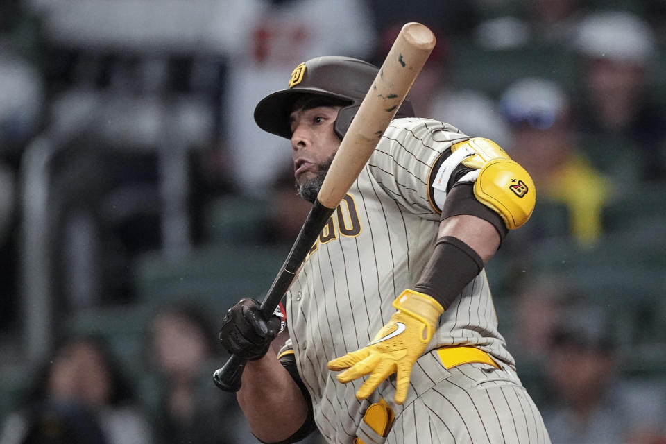 San Diego Padres designated hitter Nelson Cruz runs to first base after hitting a two-run single in the sixth inning of a baseball game against the Atlanta Braves, Sunday, April 9, 2023, in Atlanta. (AP Photo/John Bazemore)