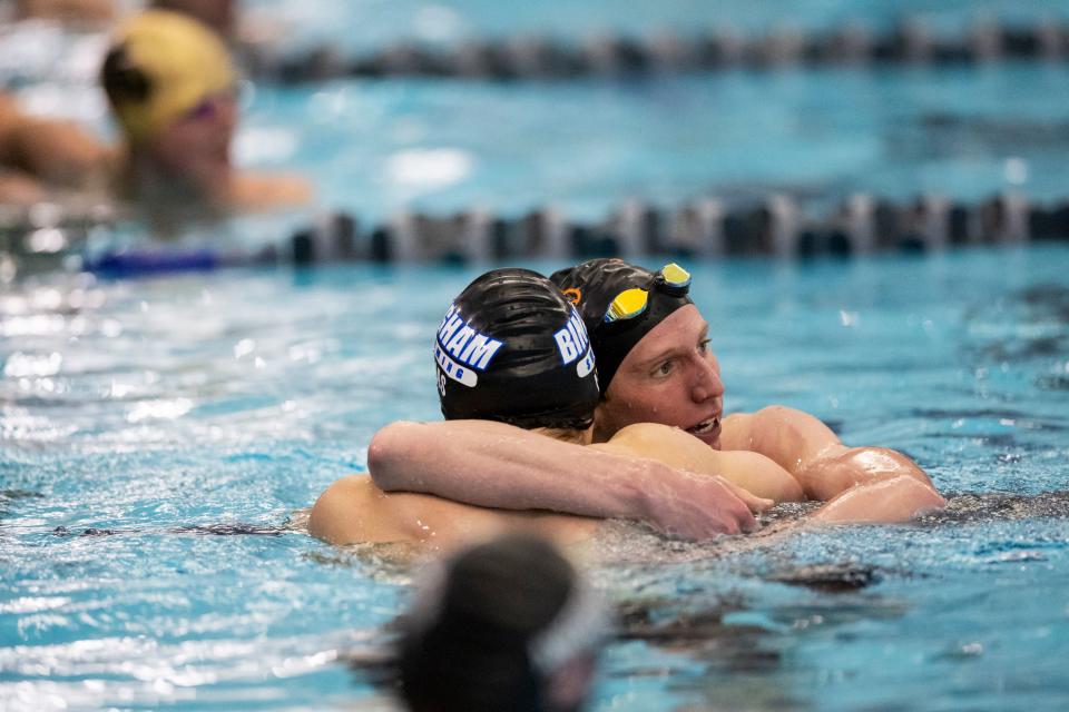 Nate Moir of Skyridge High School hugs Lincoln Hymas of Bingham High School after they compete at the Utah 6A State Meet at the Stephen L. Richards Building in Provo on Saturday, Feb. 24, 2024. | Marielle Scott, Deseret News