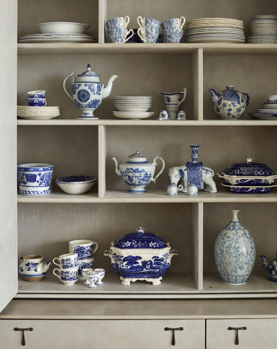 A parchment leather–covered cabinet, also from BBDW, showcases the couple’s collection of vintage china, hand-picked from estate sales and antiques shops when they lived on the East Coast and summered in Connecticut. The delicate blue-and-white treasures traveled with them in their move to California.