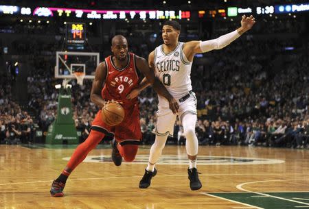 Nov 12, 2017; Boston, MA, USA; Toronto Raptors forward Serge Ibaka (9) controls the ball from Boston Celtics forward Jayson Tatum (0) during the second half at TD Garden. Bob DeChiara-USA TODAY Sports