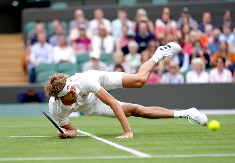 <p>Alexander Zverev slips on the grass during his first round gentlemen's singles match against Tallon Griekspoor on court 1 on day two of Wimbledon at The All England Lawn Tennis and Croquet Club, Wimbledon. Picture date: Tuesday June 29, 2021.</p>
