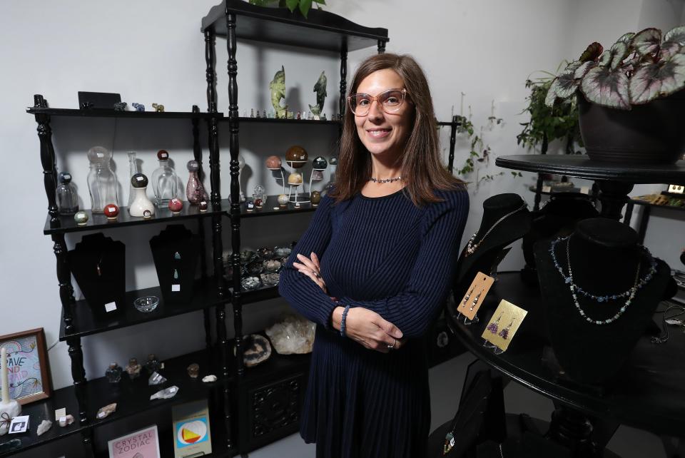 Megan Toomey is the owner of the Meta Crystal Shop inside the Mellwood Arts Center in Louisville, Ky. on Oct. 8, 2023.