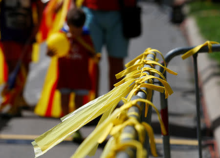 Yellow ribbons are seen on a barrier during Catalonia's national day 'La Diada' in Barcelona, Spain, September 11, 2018. REUTERS/Enrique Calvo