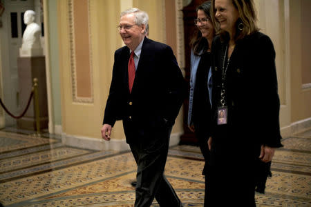 U.S. Senate Majority Leader Mitch McConnell (R-KY) walks to the Senate floor as debate wraps up over the Republican tax reform plan in Washington, U.S., December 1, 2017. REUTERS/James Lawler Duggan