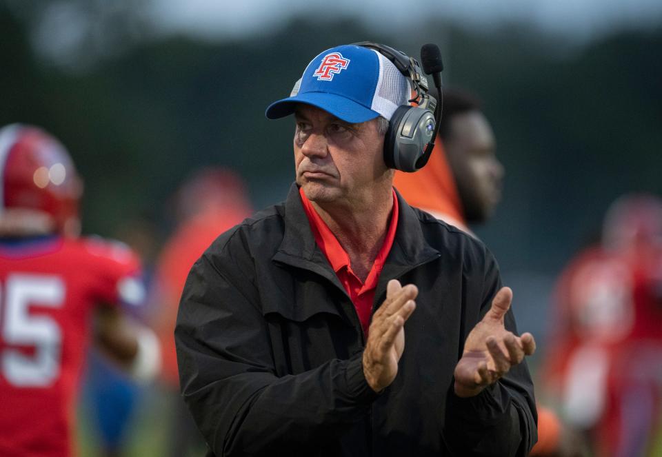 Eagles head coach Ronnie Douglas cheers on his players during the Tate vs Pine Forest football game at Pine Forest High School in Pensacola on Thursday, Aug. 25, 2022.