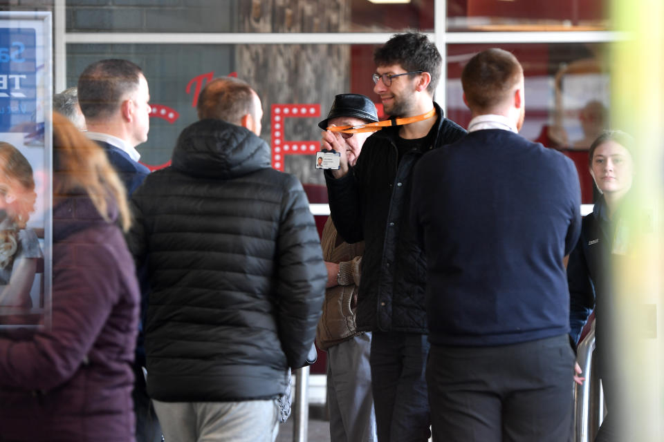 MANCHESTER,  ENGLAND - MARCH 22: Tesco security staff check NHS identification badges as the supermarket opens an hour early for NHS staff in Wythenshawe on March 22, 2020 in Manchester, UK. Coronavirus (COVID-19) has spread to at least 182 countries, claiming over 13,069 lives and infecting more than 308,592 people. There have now been 5,018 diagnosed cases in the UK and 233 deaths. (Photo by Anthony Devlin/Getty Images)