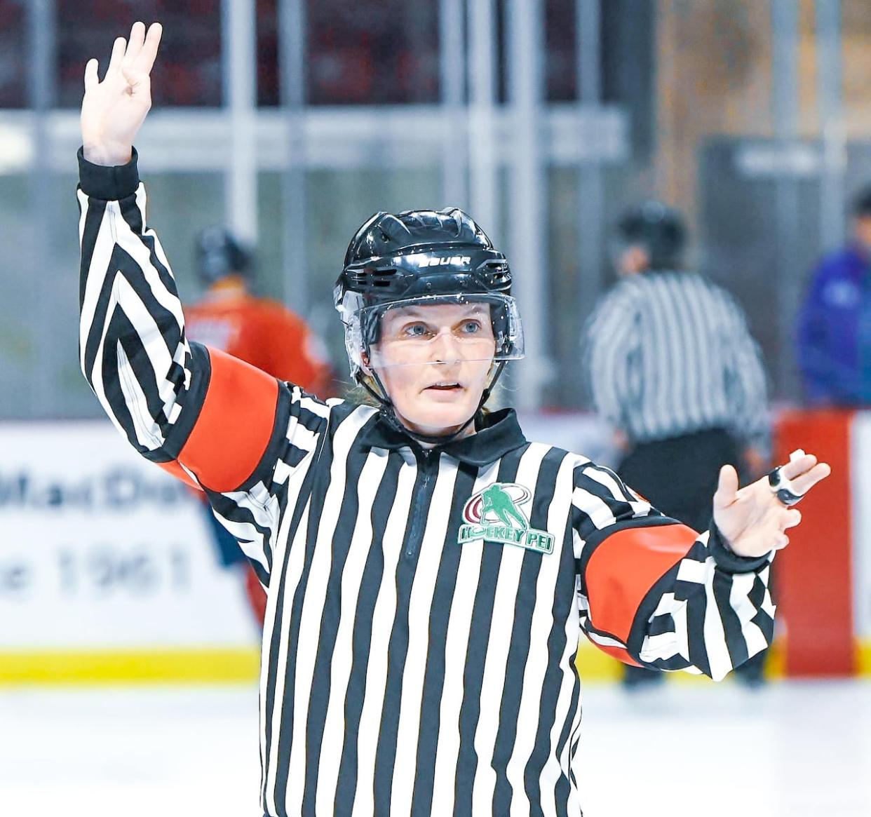 Ellen Dixon made her official debut as a referee in the Maritime Junior Hockey League at a game in Summerside on Dec. 7.   (Ronnie MacKenzie/Summerside Western Capitals - image credit)
