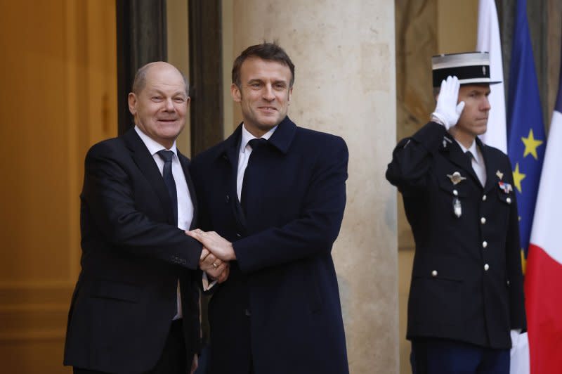 Calls for troops on the ground by French President Emmanuel Macron following a Ukraine crisis summit in Paris have prompted the United States, Britain and Germany to re-iterate their non-interventionist stances, adding to a growing list of NATO allies rejecting the idea. German Chancellor Olaf Scholz (L) received a warm welcome from Macron (C) on Monday as he arrived for the summit at the Elysee Palace. Yoan Valat/EPA-EFE
