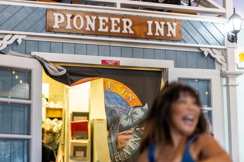 A woman at Back Home in Lahaina, which is decorated to evoke major Lahaina landmarks such as the Pioneer Inn.