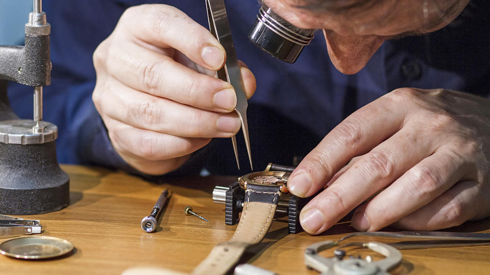 A man repairing a watch.